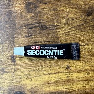 Black Nail Adhesive Tube